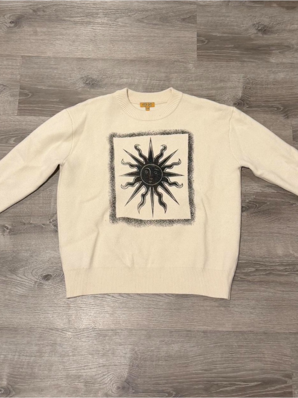 Verge Girl cream sweater with sun design